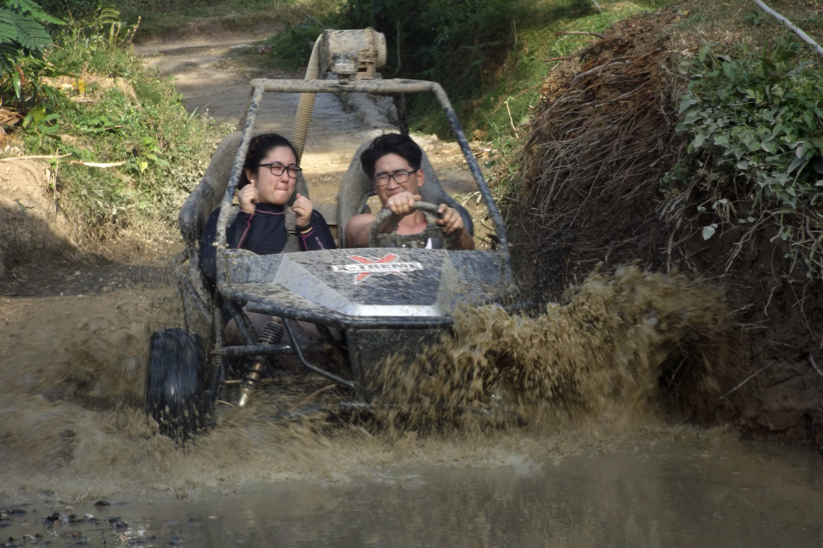 Couples having a great time driving Mud Kart in Extreme Sports Philippines Adventure Park in Puerto Galera.